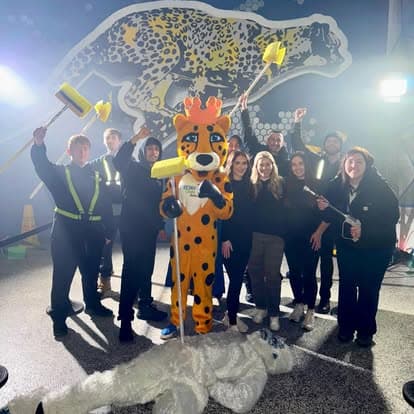 The Cheetah Clean team with the mascot